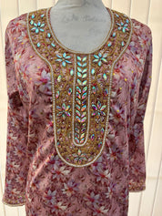 Israa Mukhwar (L) 56