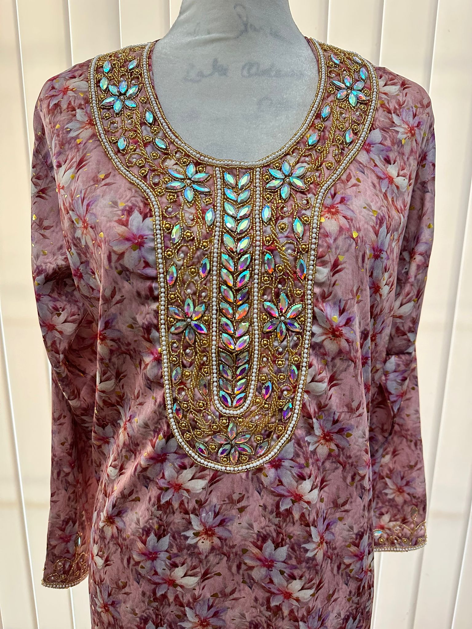 Israa Mukhwar (L) 56