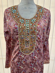 Israa Mukhwar (L) 56